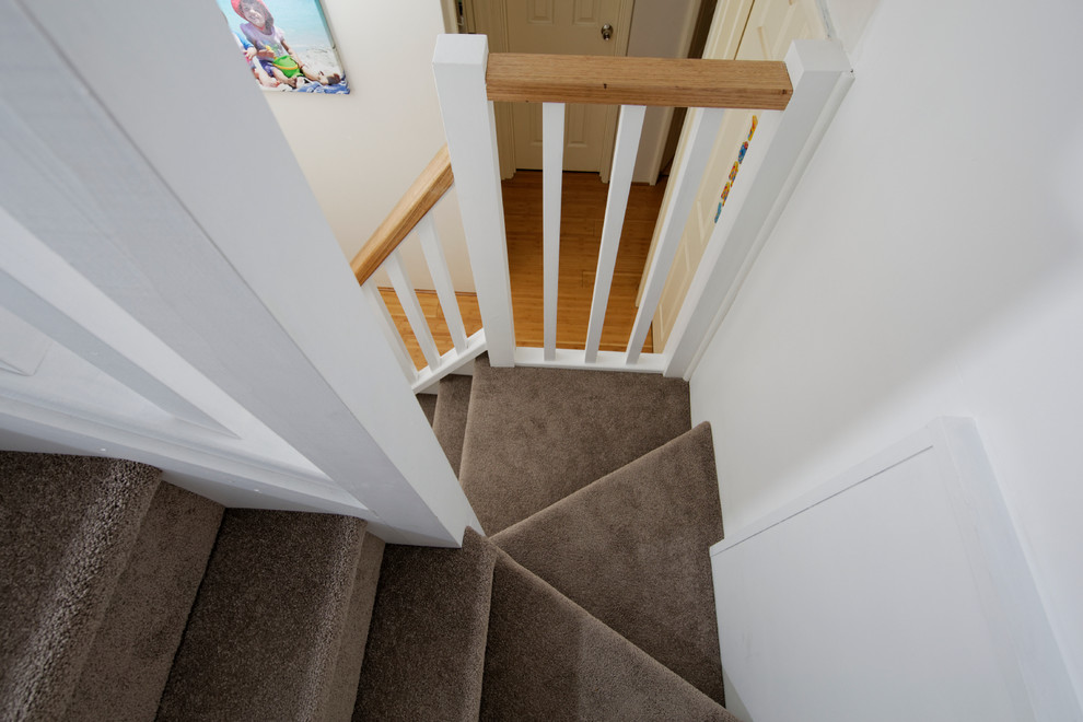 Example of a small minimalist carpeted l-shaped staircase design in Perth with carpeted risers