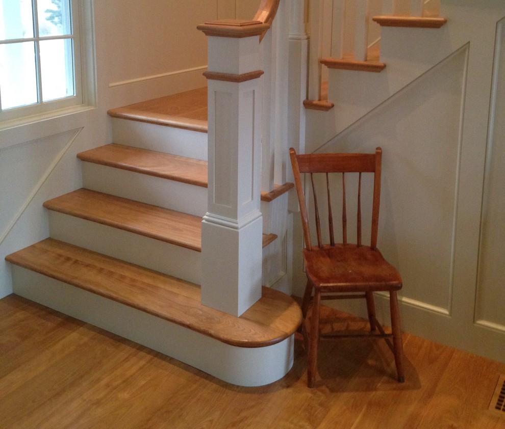 Design ideas for a small classic wood l-shaped staircase in Boston with painted wood risers.