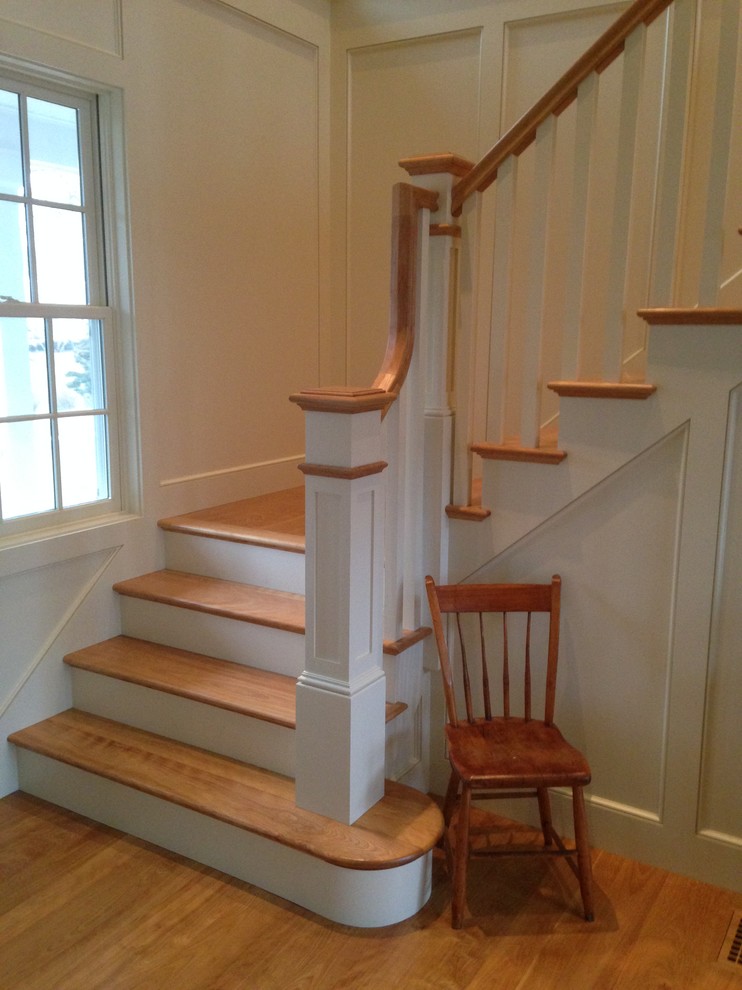 Small elegant wooden l-shaped staircase photo in Boston with painted risers