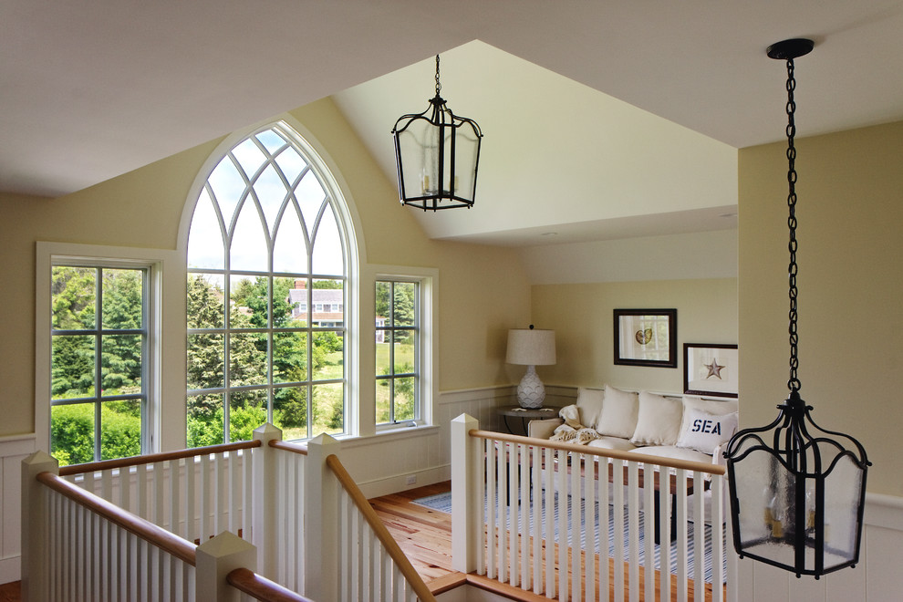 Design ideas for a traditional staircase in Boston with feature lighting.