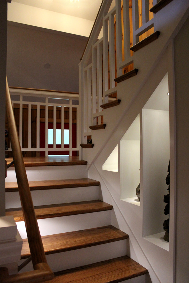 Design ideas for a small classic wood u-shaped staircase in Other with painted wood risers.