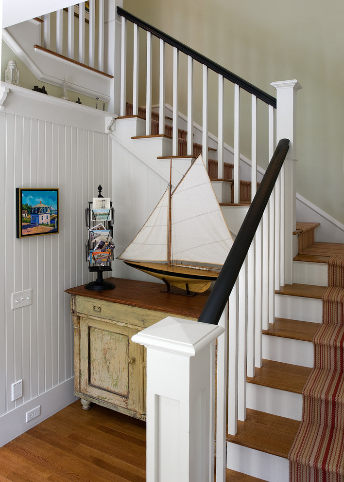 Elegant wooden staircase photo in Portland Maine