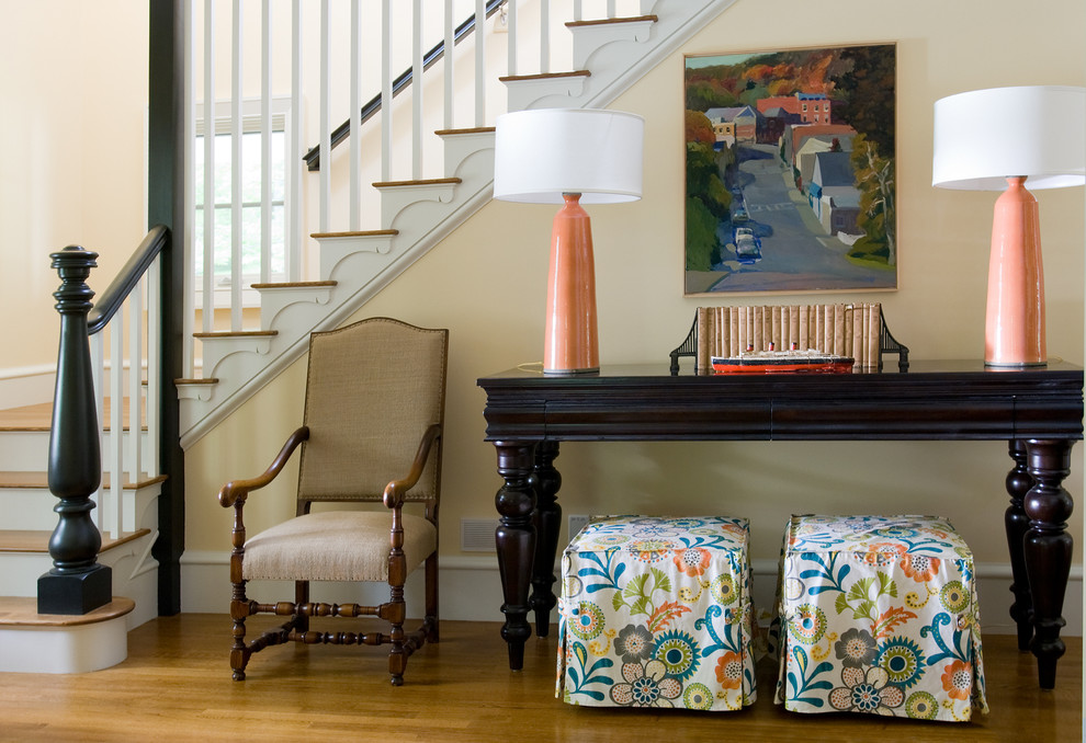 Photo of a traditional staircase in Portland Maine with feature lighting.