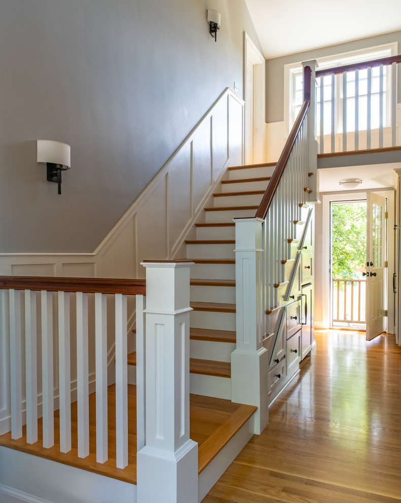 Inspiration for a mid-sized timeless wooden l-shaped wood railing staircase remodel in Boston with painted risers