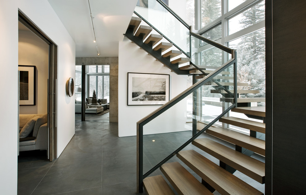 Staircase - modern wooden open and glass railing staircase idea in Denver