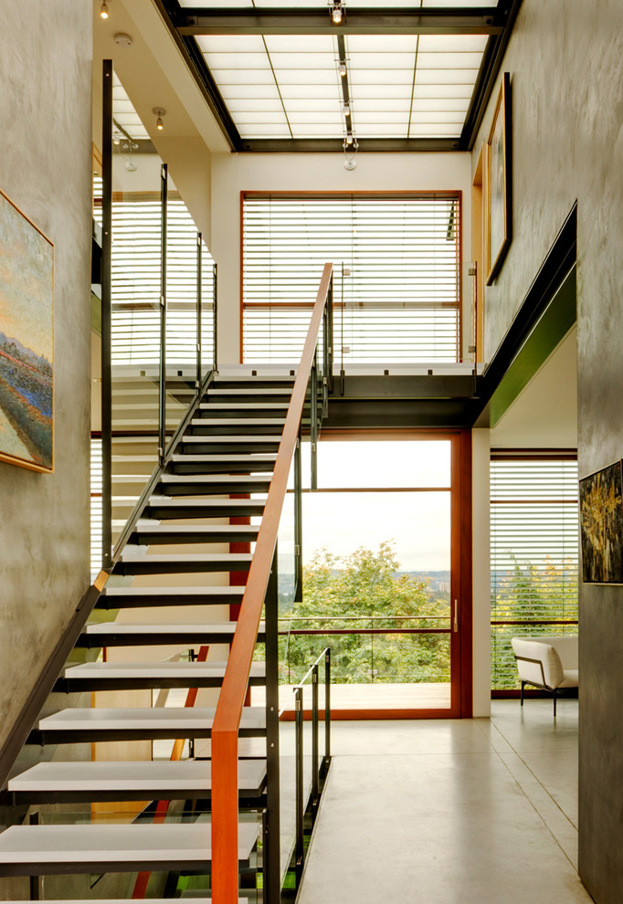 Inspiration for a contemporary glass straight staircase in Seattle with open risers.