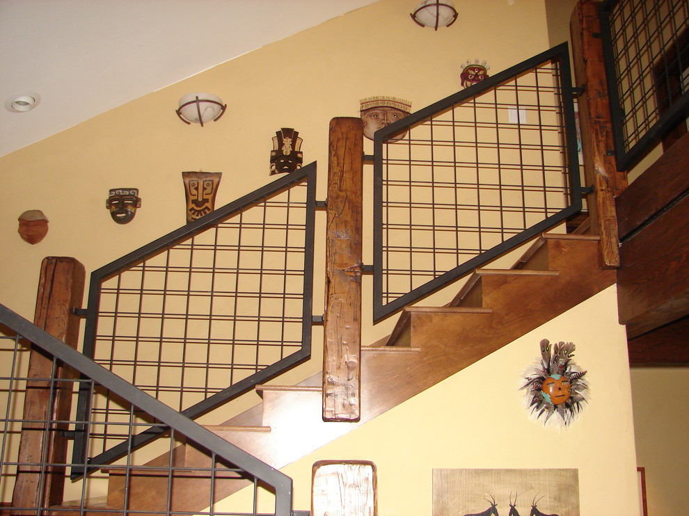 Photo of a rustic staircase in Denver with feature lighting.