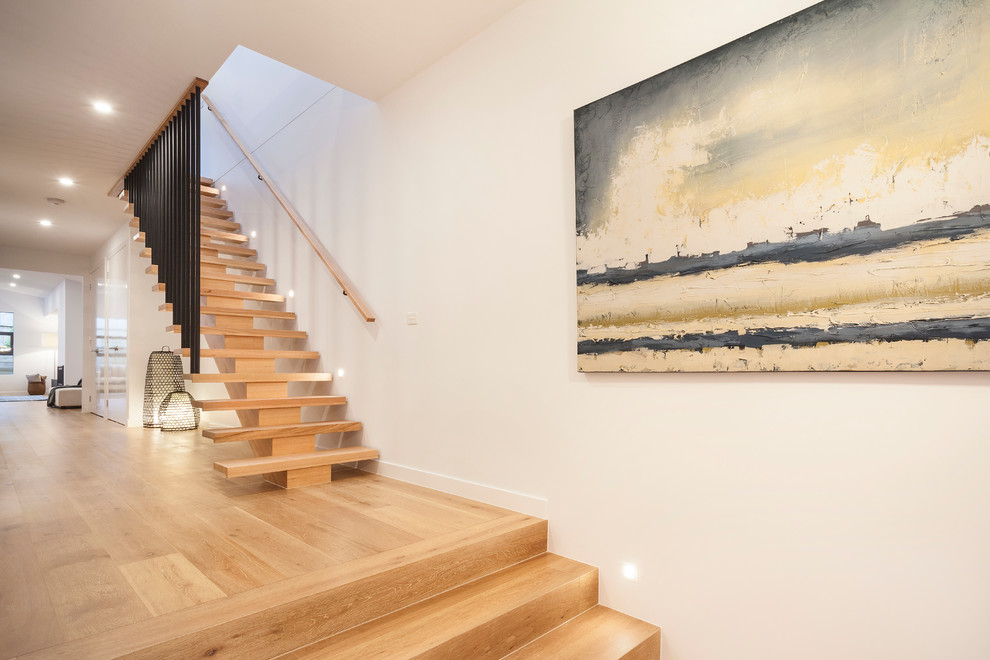 Inspiration for a mid-sized contemporary wooden straight wood railing staircase remodel in Melbourne with wooden risers