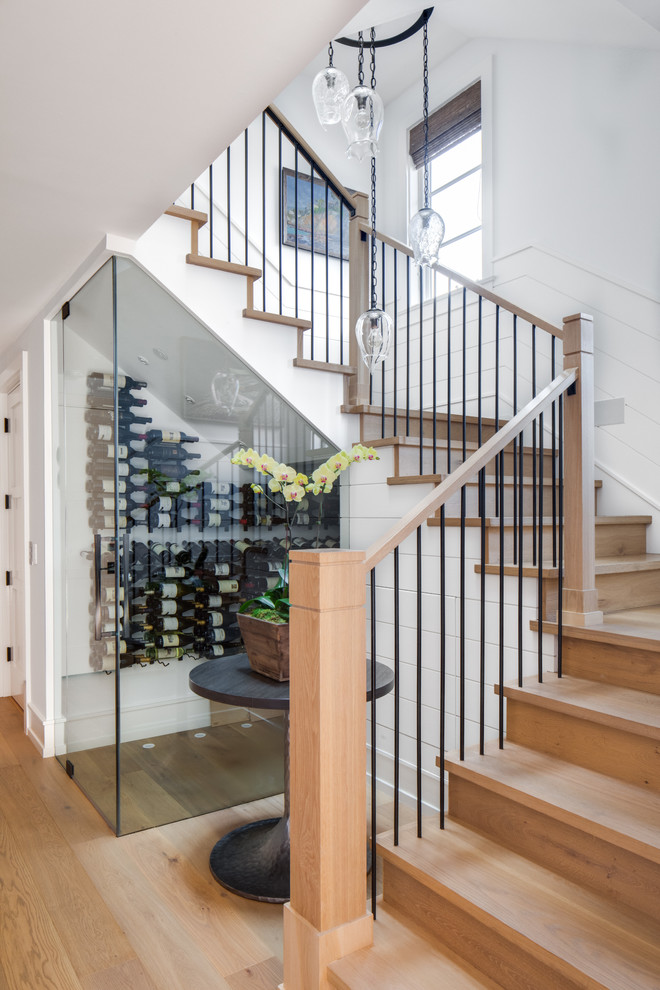 Ejemplo de escalera en U contemporánea de tamaño medio con escalones de madera, contrahuellas de madera y barandilla de varios materiales
