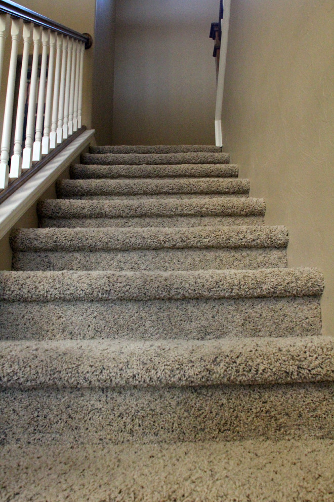 Design ideas for a medium sized classic carpeted u-shaped staircase in Denver with carpeted risers.