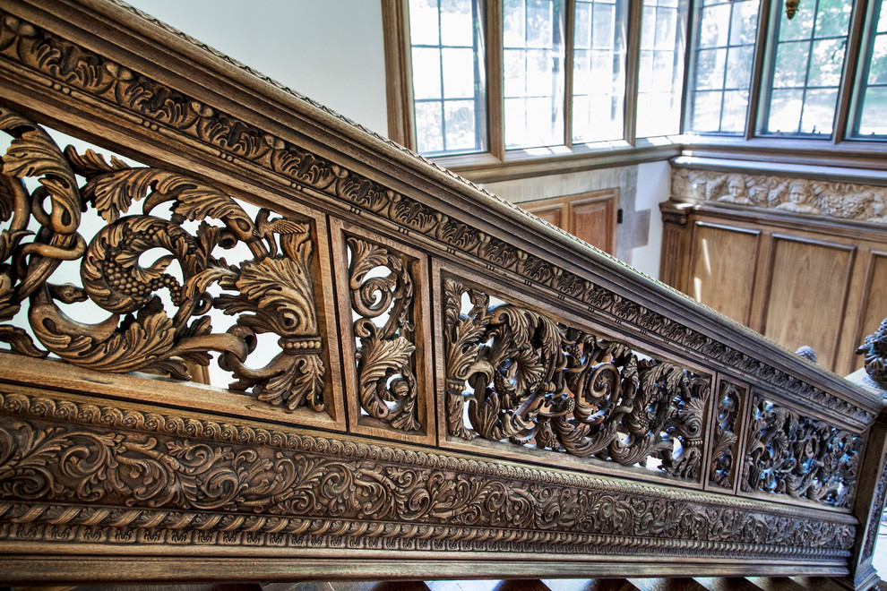 This is an example of a large traditional l-shaped wood railing staircase in New York.