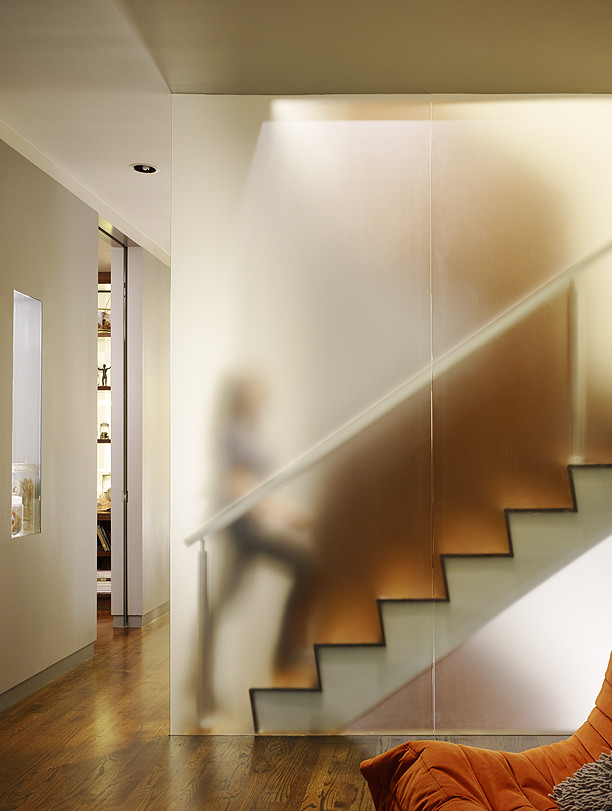 Inspiration for a small modern wooden u-shaped staircase remodel in San Francisco with wooden risers