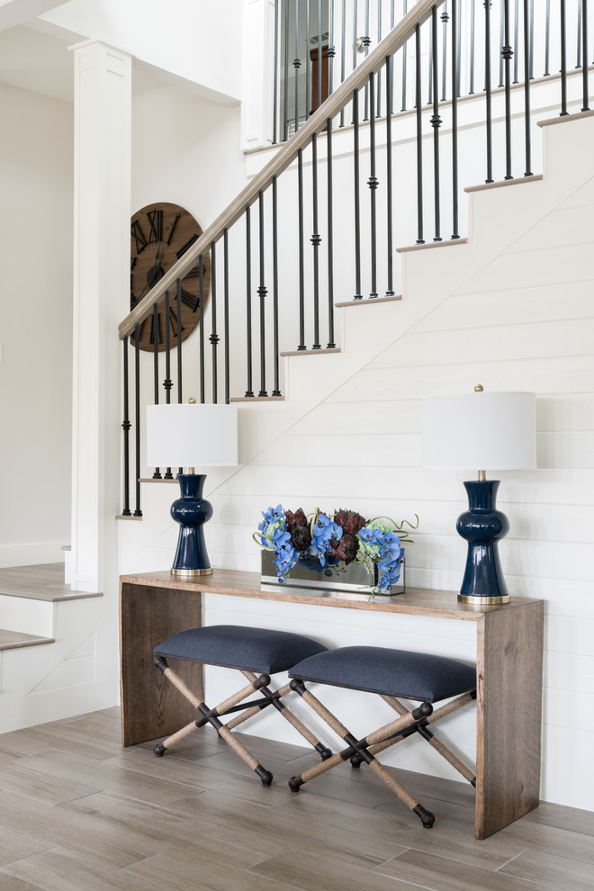 Example of a mid-sized tile l-shaped mixed material railing staircase design with wooden risers
