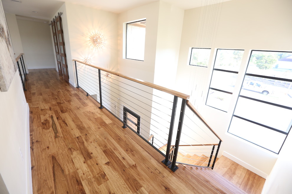 Example of a mid-sized trendy wooden u-shaped open and cable railing staircase design in Dallas