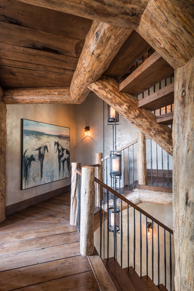 Rustic wood u-shaped staircase in Other with open risers.