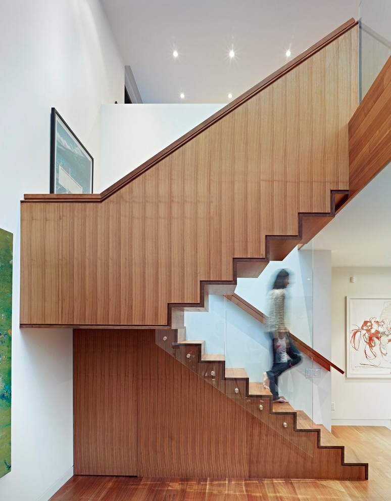 Inspiration for a contemporary wood staircase in Toronto with wood risers.