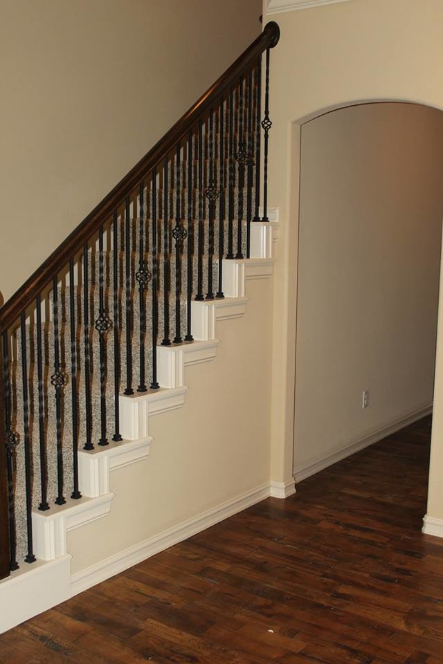 Medium sized classic carpeted straight staircase in Other with carpeted risers.