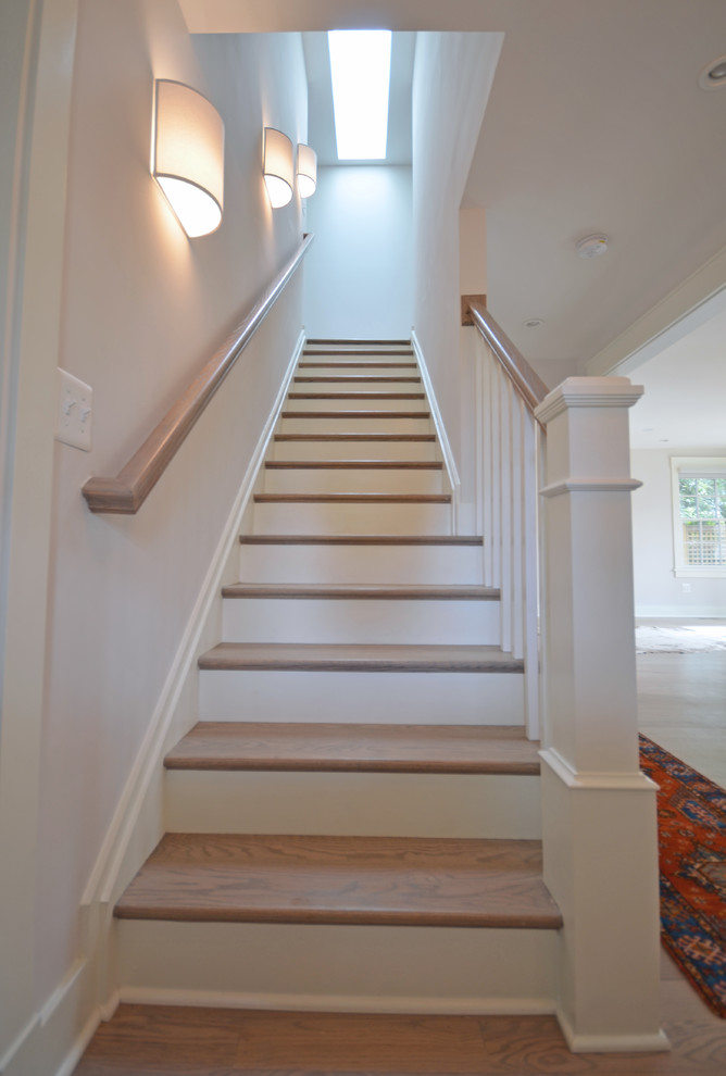 Inspiration for a mid-sized timeless wooden straight wood railing staircase remodel in DC Metro with painted risers