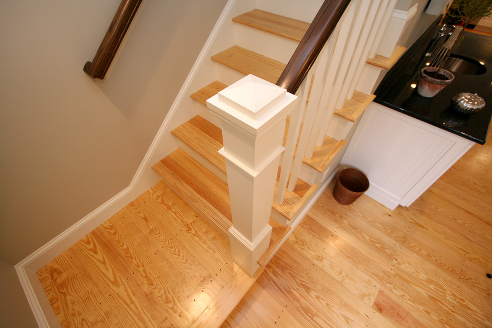 Coastal wood staircase in Boston with wood risers.