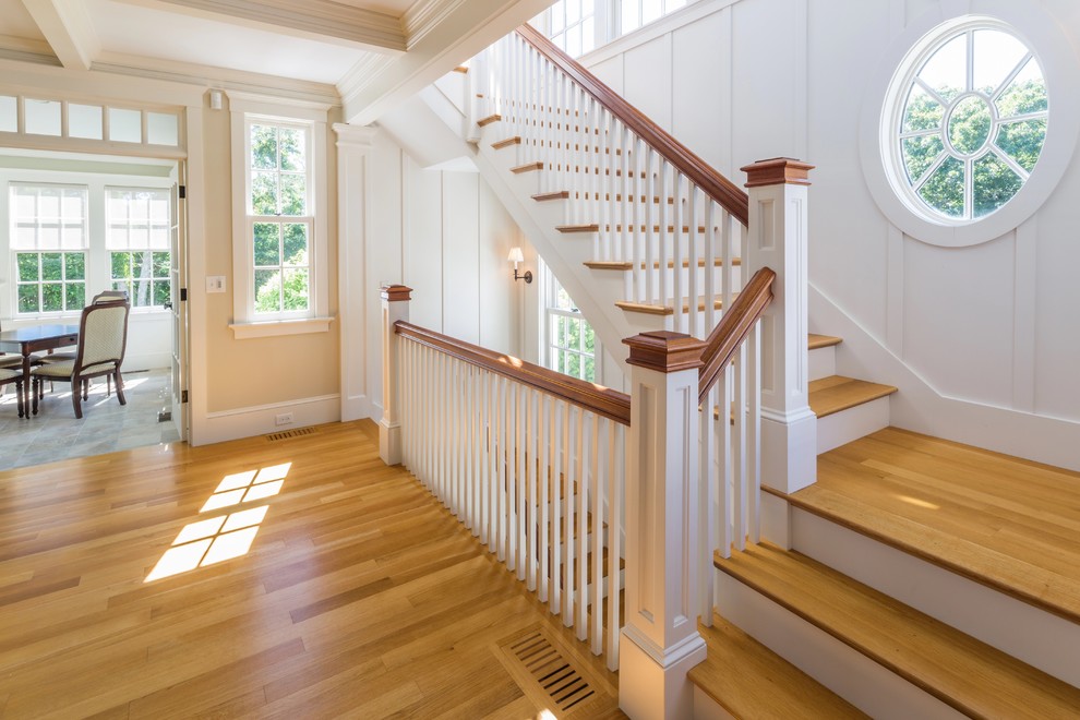 Mid-sized elegant wooden l-shaped staircase photo in Boston with painted risers