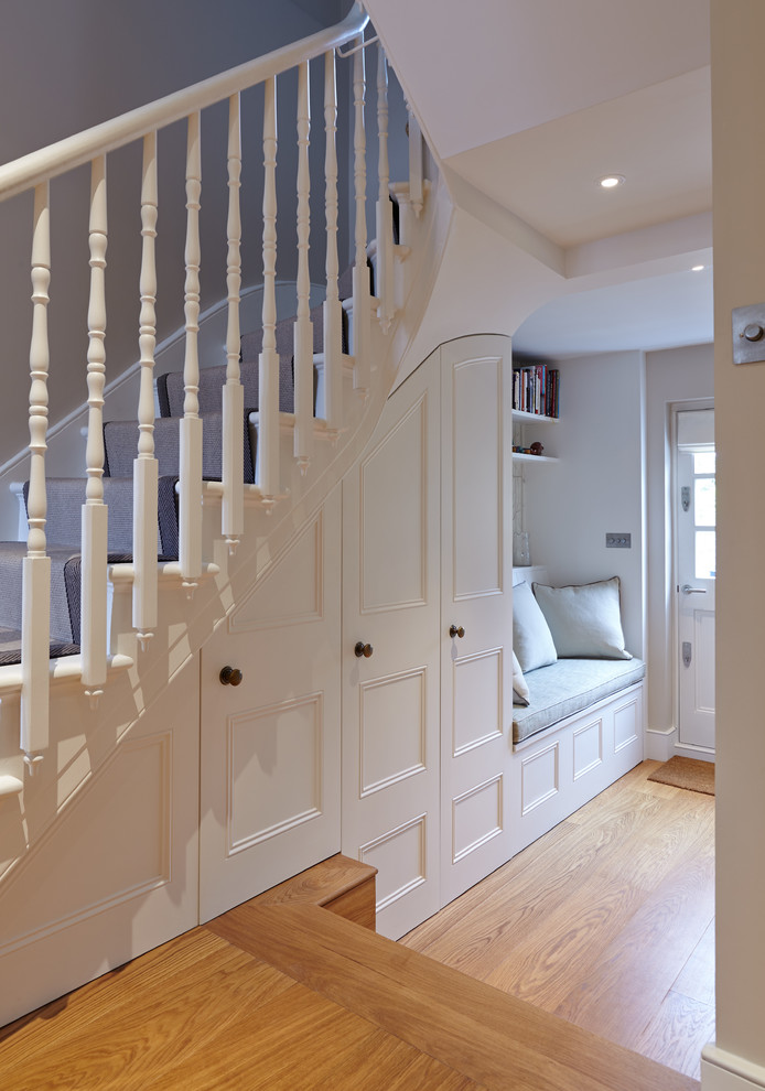 Classic staircase in London with under stair storage.
