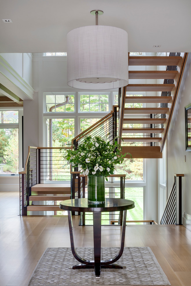 Staircase - large transitional wooden l-shaped staircase idea in Boston with wooden risers