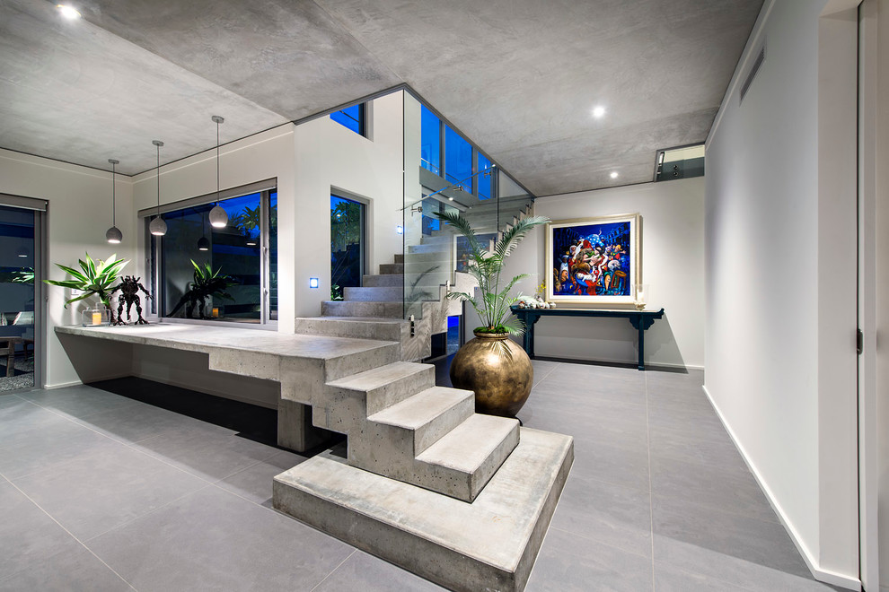 Photo of a large contemporary concrete l-shaped staircase in Perth with concrete risers.
