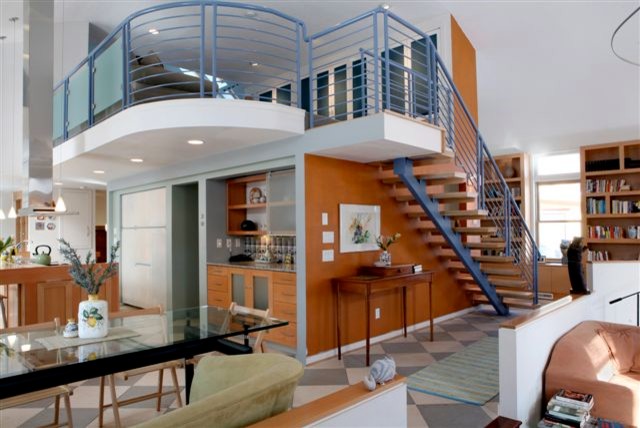 Large contemporary wood straight metal railing staircase in Cedar Rapids with open risers.
