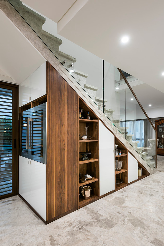 Design ideas for a contemporary straight staircase in Perth with under stair storage.