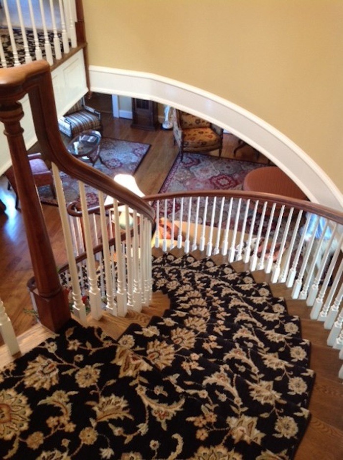 Design ideas for a large traditional painted wood curved staircase in Other with painted wood risers.