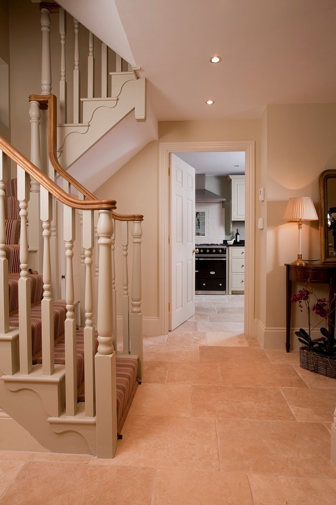 This is an example of a medium sized rural concrete staircase in London with carpeted risers and feature lighting.
