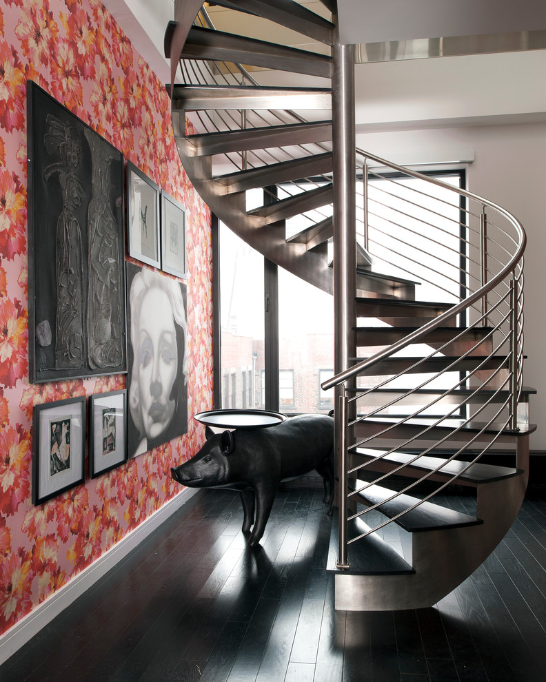 This is an example of a contemporary wood spiral staircase in New York with open risers.