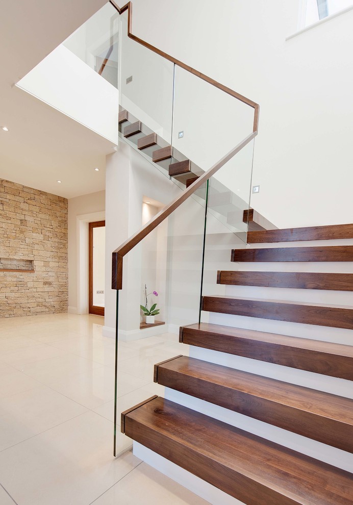 This is an example of a contemporary wood l-shaped staircase in Other with painted wood risers.