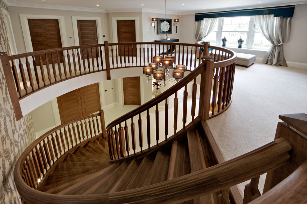 Design ideas for a contemporary wood curved staircase in London.