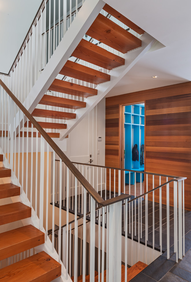 Example of a mid-sized trendy wooden floating open staircase design in Minneapolis
