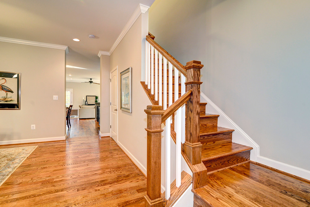 Inspiration for a timeless wooden l-shaped staircase remodel in DC Metro with wooden risers