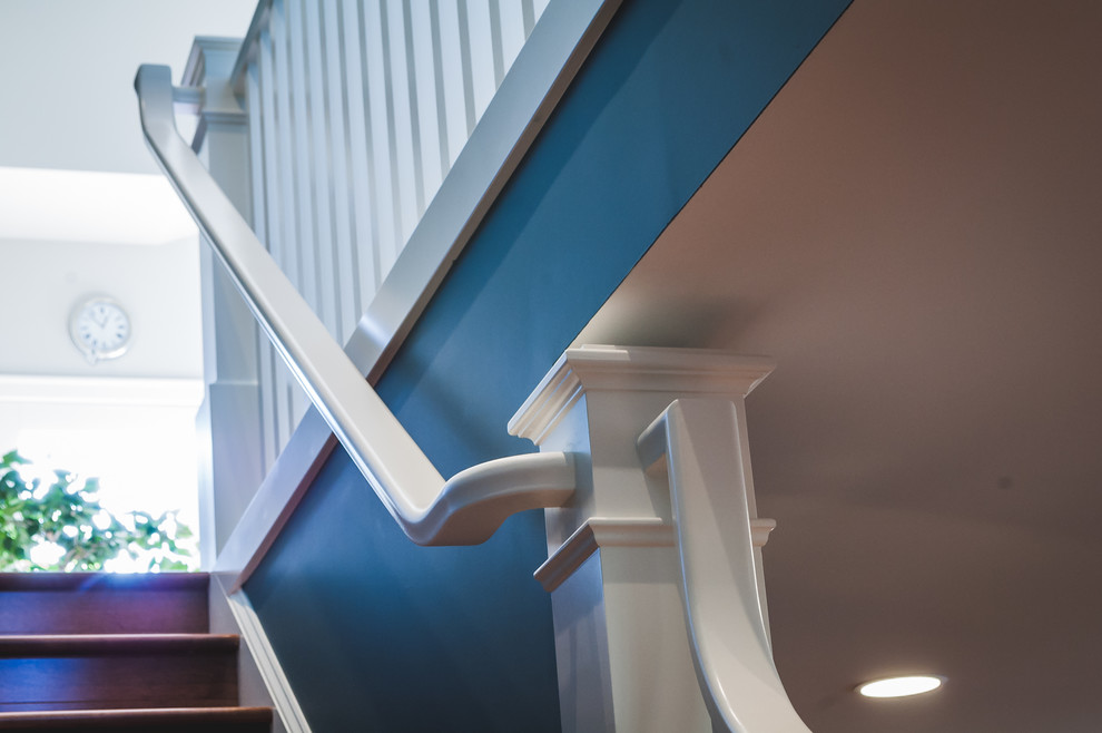 Design ideas for a classic wood straight staircase in Other with wood risers.