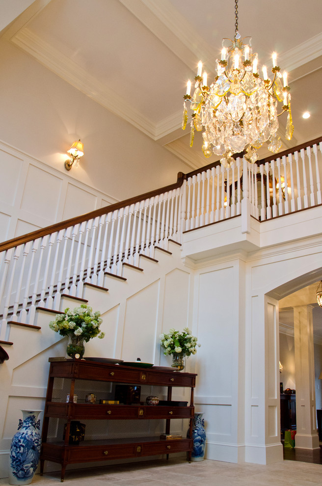 Inspiration for a large classic wood straight wood railing staircase in New York with painted wood risers.