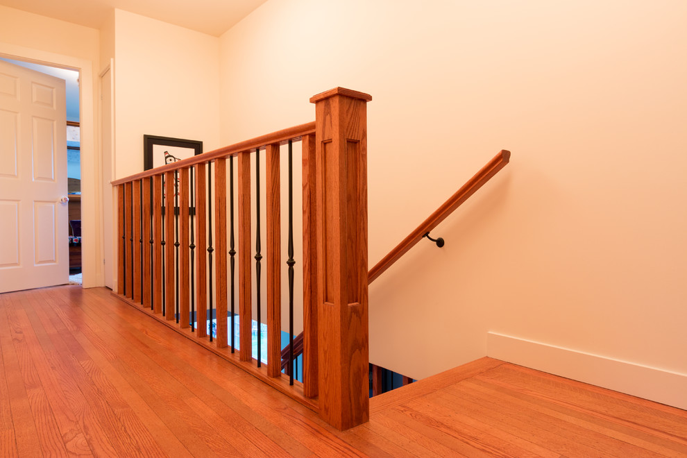 Mid-sized elegant wooden l-shaped staircase photo in Vancouver with wooden risers