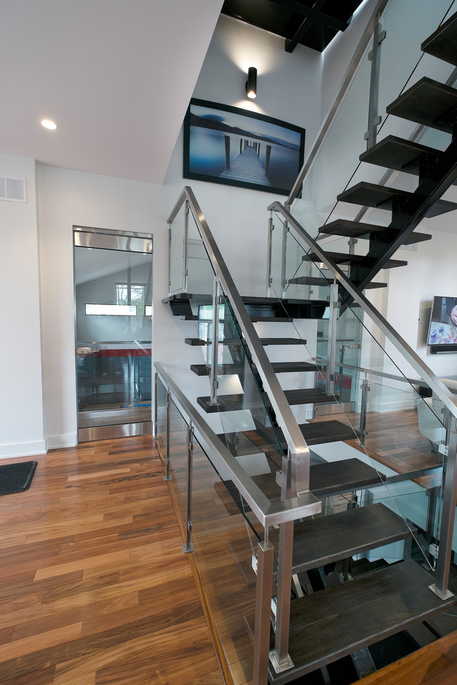 Photo of a medium sized modern floating staircase in Ottawa.