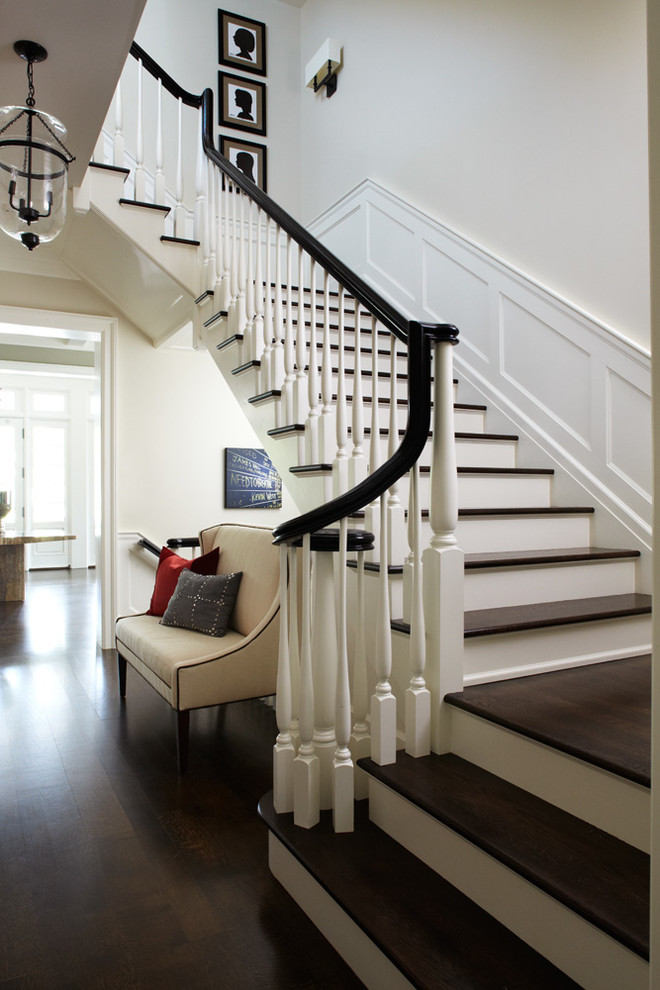 This is an example of a large contemporary wood l-shaped wood railing staircase in Chicago with wood risers.