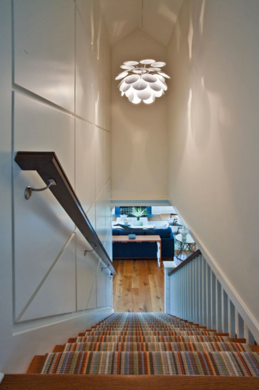 Design ideas for a medium sized eclectic wood straight staircase in Providence.