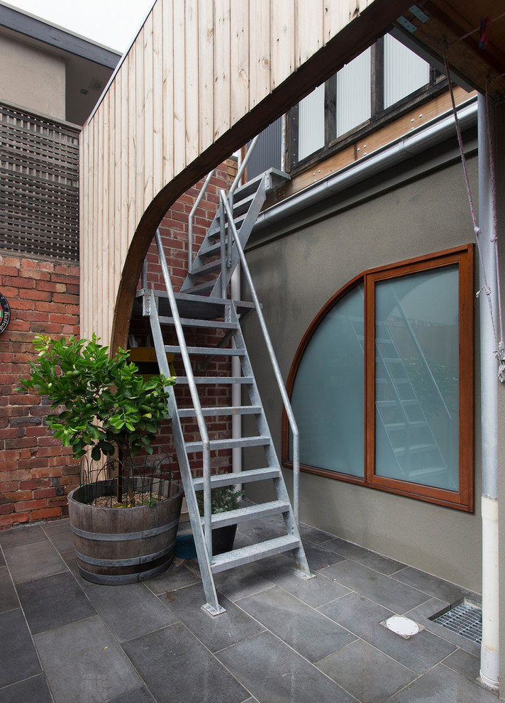 Staircase - small contemporary metal l-shaped staircase idea in Melbourne with metal risers