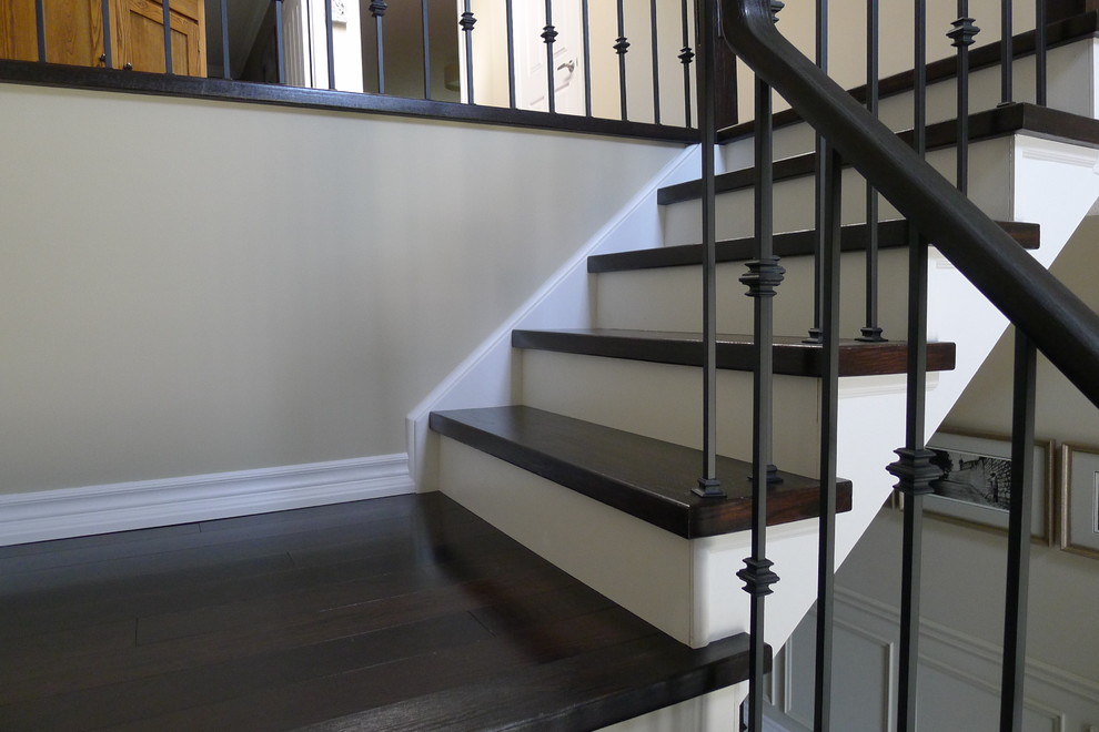 closeup of Dark hardwood stairs white risers Burlington Ontario