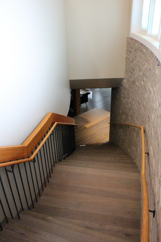 Inspiration for a large industrial curved staircase remodel in DC Metro
