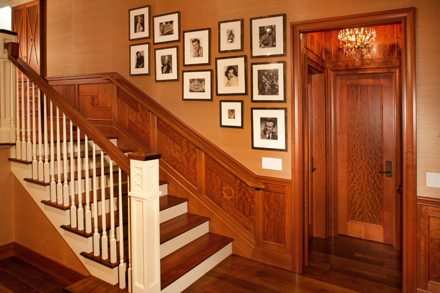 Medium sized traditional wood straight wood railing staircase in San Diego with painted wood risers.