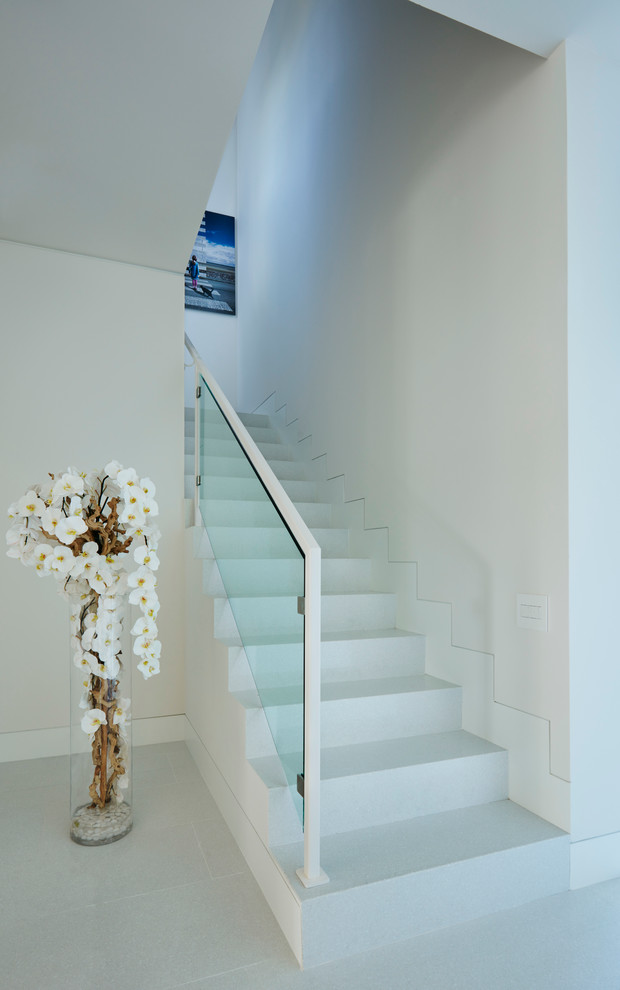 Design ideas for a medium sized contemporary concrete u-shaped staircase in Miami with concrete risers.