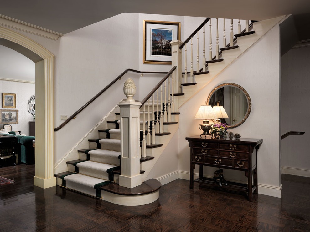 This is an example of a classic staircase in Vancouver with feature lighting.