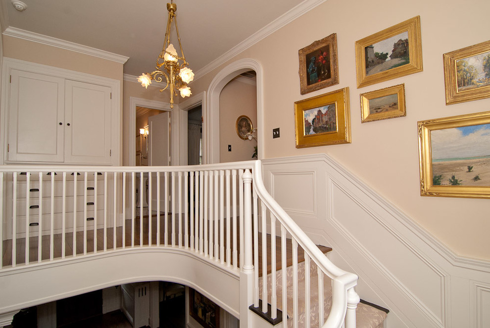 Example of a classic carpeted u-shaped staircase design in Bridgeport with carpeted risers