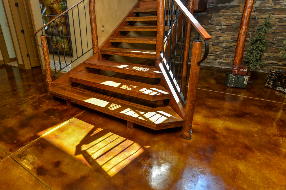 Example of a mid-sized mountain style wooden u-shaped open staircase design in Denver